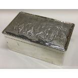 A large Victorian silver cigar box with embossed lid. London 1897.