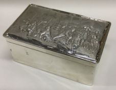 A large Victorian silver cigar box with embossed lid. London 1897.