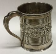A William IV silver embossed christening mug. London 1834.