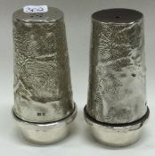 A pair of contemporary silver salt and pepper condiments. London 1971. By SJR.