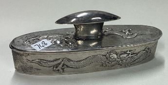 A Chinese chased silver box with pull off lid. Marked to base.