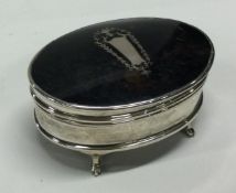 A silver and tortoiseshell oval trinket box. Birmingham 1927.