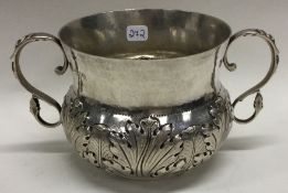 A Charles II style silver chased porringer. London 1907.