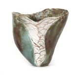 A studio pottery vase of organic form decorated with scales, in the manner of Michael Cardew and