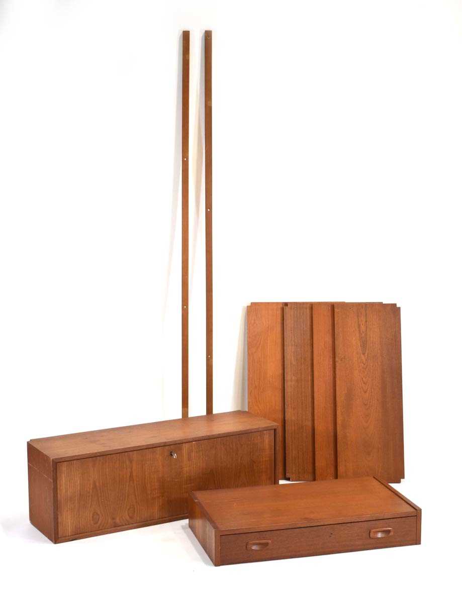 A 1960's Danish teak modular shelving system by Poul Cadovius including a bureau, writing table, two
