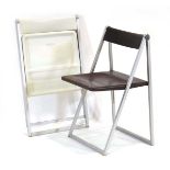 A pair of German folding chairs in brown and white, designed in 1971 by Team Form AG, manufactured