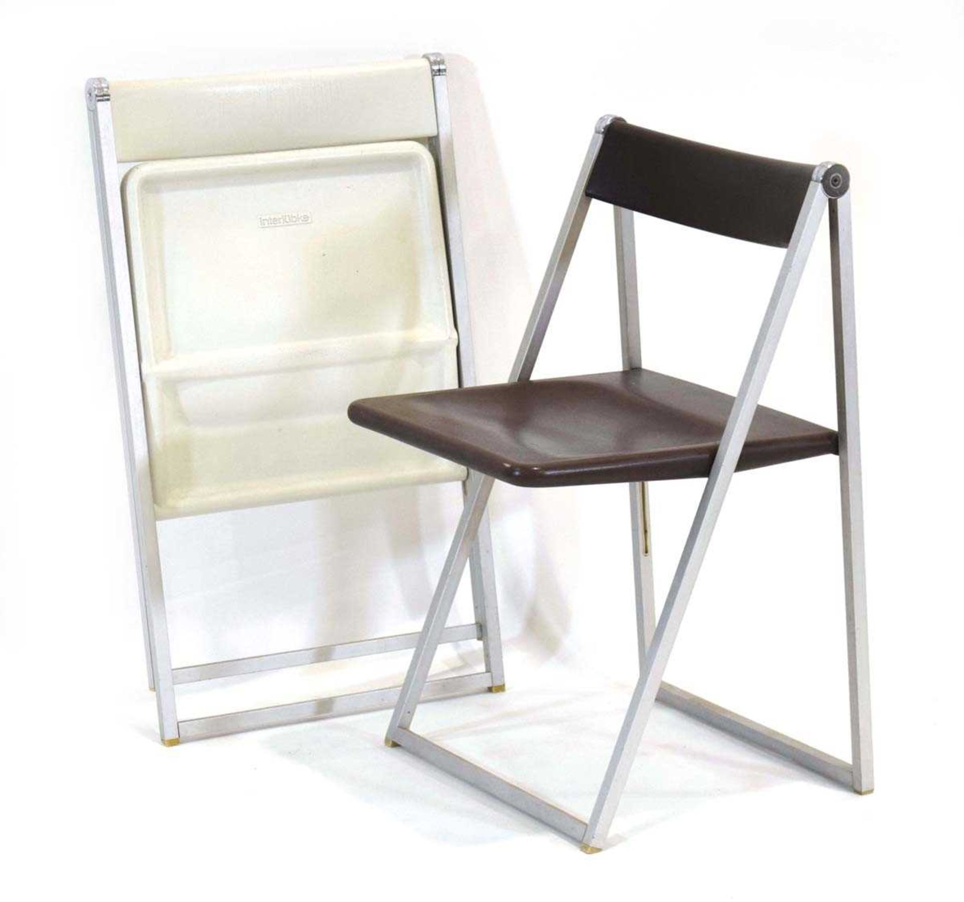 A pair of German folding chairs in brown and white, designed in 1971 by Team Form AG, manufactured