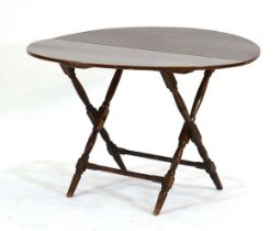 A coaching or campaign type folding table by Thornton & Hearne, d. 95 cm
