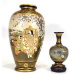 A Japanese Meiji Period 'Satsuma' ware vase, decorated with bijin and children in two panels, within
