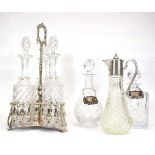 A silver plated three bottle stand, h. 41.5 cm, a claret jug with plated mounts, two glass