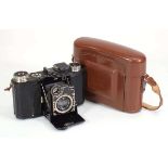 A Zeiss Ikon Super Nettel camera with a Carl Zeiss Jena lens, in a faux leather cover