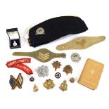 A group of militaria including Beds & Herts patches and badges, Active Service New Testament,