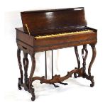 An American 19th century melodion or reed organ, c. 1865, in a rosewood case with lyre supports,