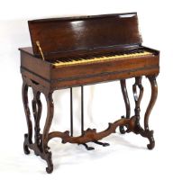 An American 19th century melodion or reed organ, c. 1865, in a rosewood case with lyre supports,