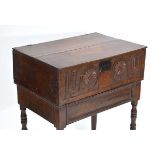 A 17th century and later oak Bible box-on-stand, the carved front converted to a drawer, on turned