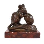 After Clovis-Edmond Masson, a French brown patinated bronze modedlled as a mouse gnawing a walnut on