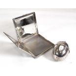 A mid-20th century silver engine turned compact of square form, Birmingham 1951, w. 7.5 cm and a