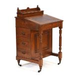 A Victorian walnut and tooled leather davenport, the interior fitted in burr satinwood, w. 58 cm