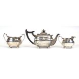 An early 20th century silver three piece bachelors' tea service, Edward Barnard & Sons Ltd.,