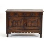 An 18th century and later panelled oak coffer with a lift lid and two doors, w. 98 cm