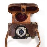 A Leica Rangefinder II camera, circa 1931, with a Leitz Elmar f=5cm 1:35 lens, in a leather cover,