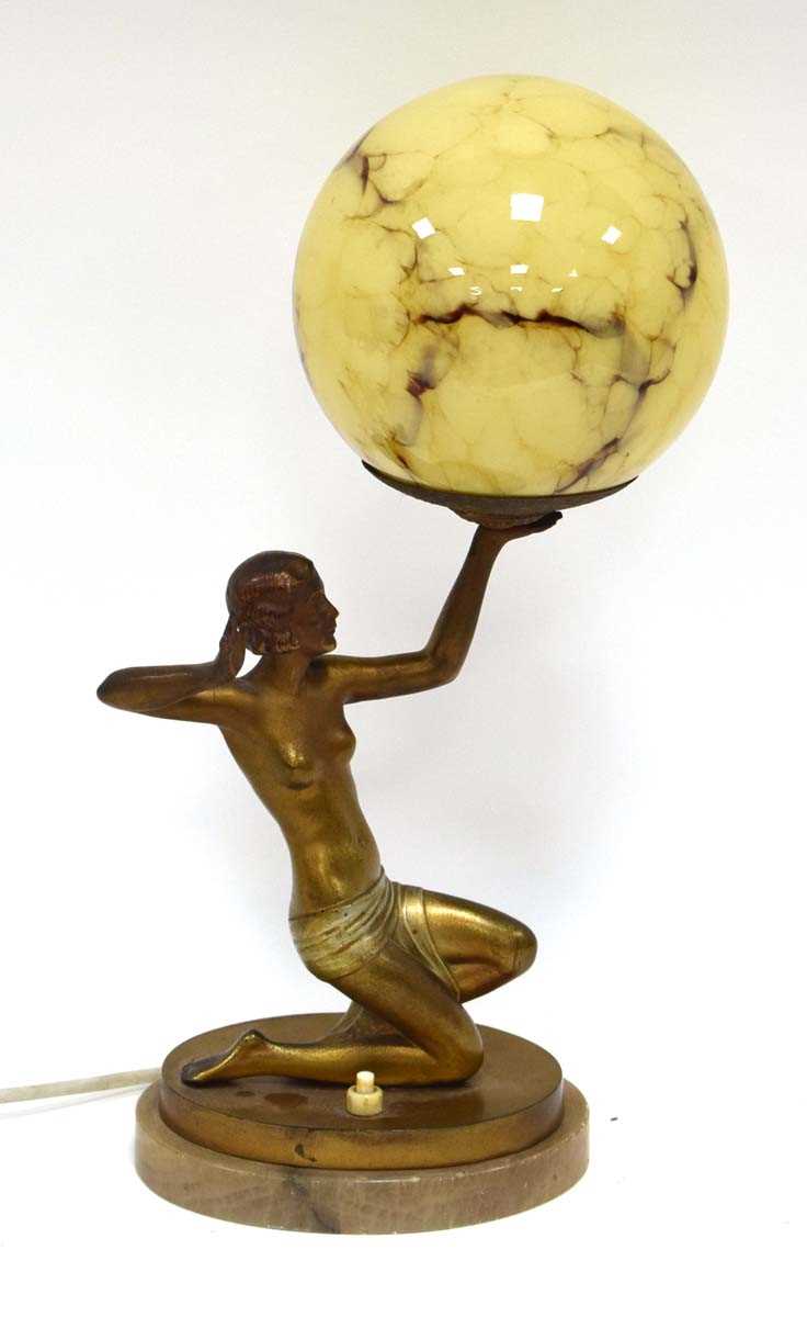 A figural table lamp in the Art Deco manner, modelled as a partially clad young lady, on a marble