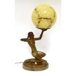 A figural table lamp in the Art Deco manner, modelled as a partially clad young lady, on a marble