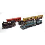 A Marx O gauge tinplate loco, tender and two coaches, together with a further loco and coach (qty)