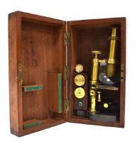 C. Baker of London, a brass and tole monocular microscope, in a fitted case containing three