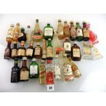about 30 assorted old miniatures including Whisky, Rum, Gin, liqueurs etc.