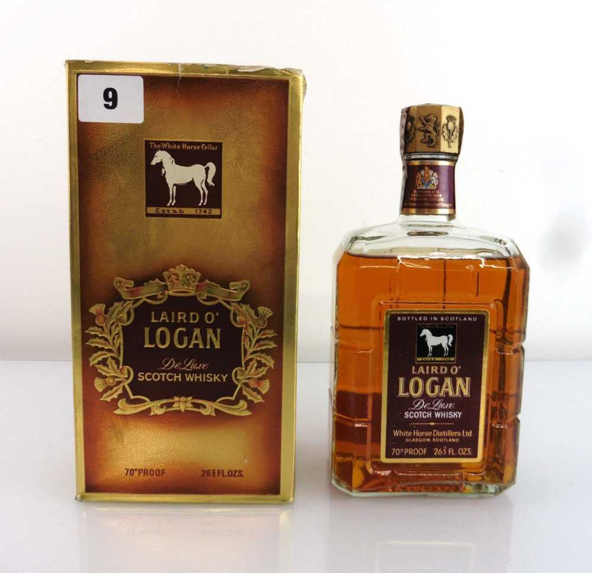 A bottle of Laird O'Logan De Luxe Scotch Whisky by The White Horse Distillers with box circa 1970'