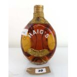 An old bottle of Haig's Dimple Scots old Blended Scotch Whisky with spring cap circa 1960's 70 proof