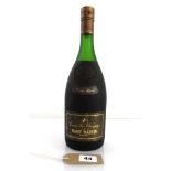 A bottle of Remy Martin Grande Reserve Cognac Reserve No. 50044 circa 1970's 24 fl oz 70 proof.