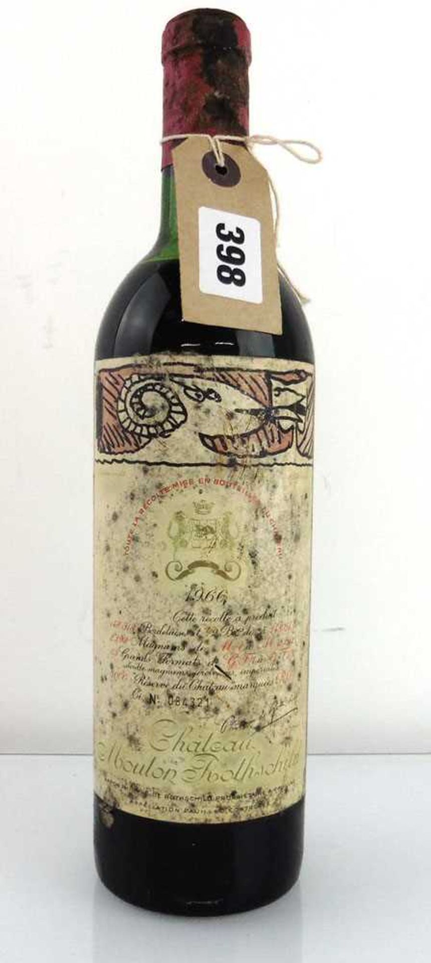 A bottle of Chateau Mouton Rothschild 1966 Pauillac (Note Label damage)(ullage upper mid shoulder)