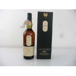 An old bottle of Lagavulin 16 year old Single Islay Malt Scotch Whisky by White Horse Distillers