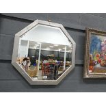 Octagonal bevelled mirror in silver painted frame