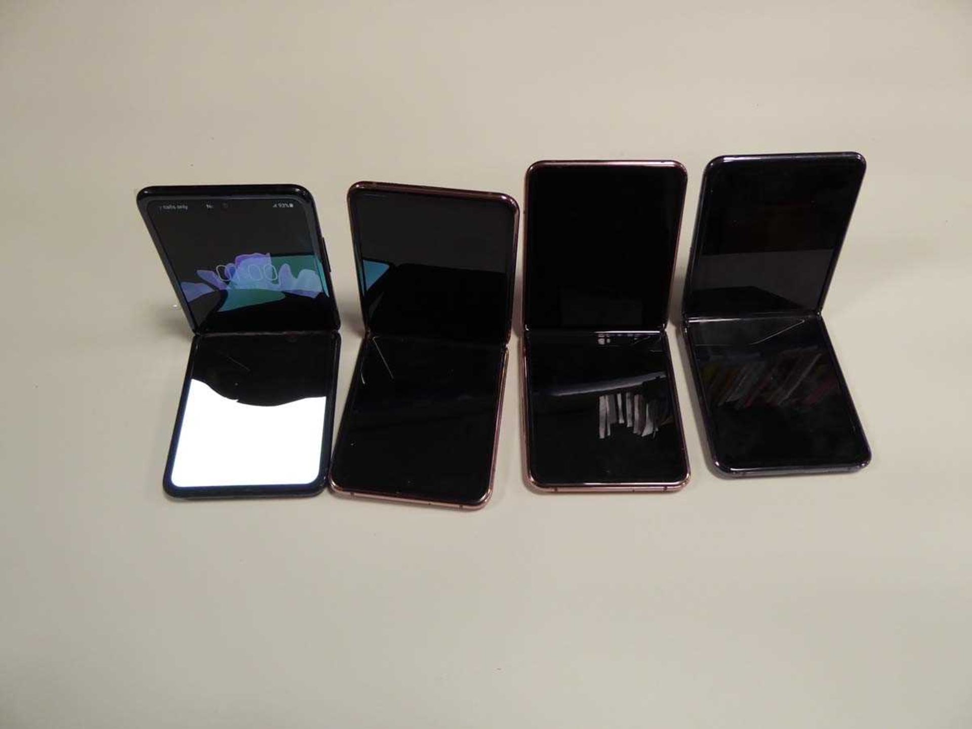 4 various Samsung Z Flip mobile phones, sold for spares and repairs, faulty screens etc