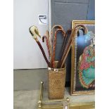 Wicker stick stand with a quantity of walking sticks