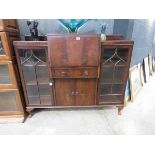 Reproduction mahogany bureau with glazed doors to the side