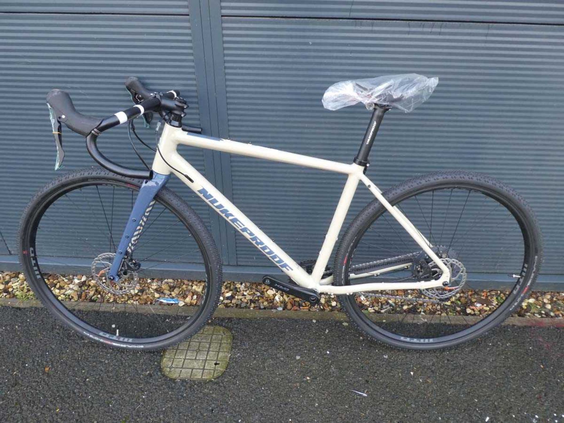 +VAT Nukeproof beige racing bike, no pedals