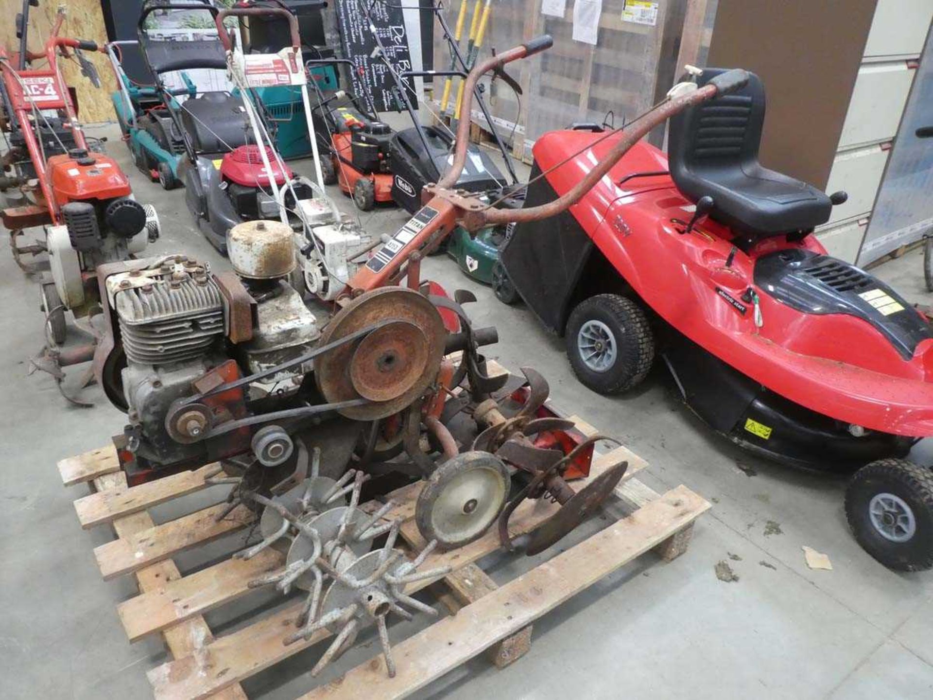 Wolseley Titan petrol powered rotavator on pallet with various attachments