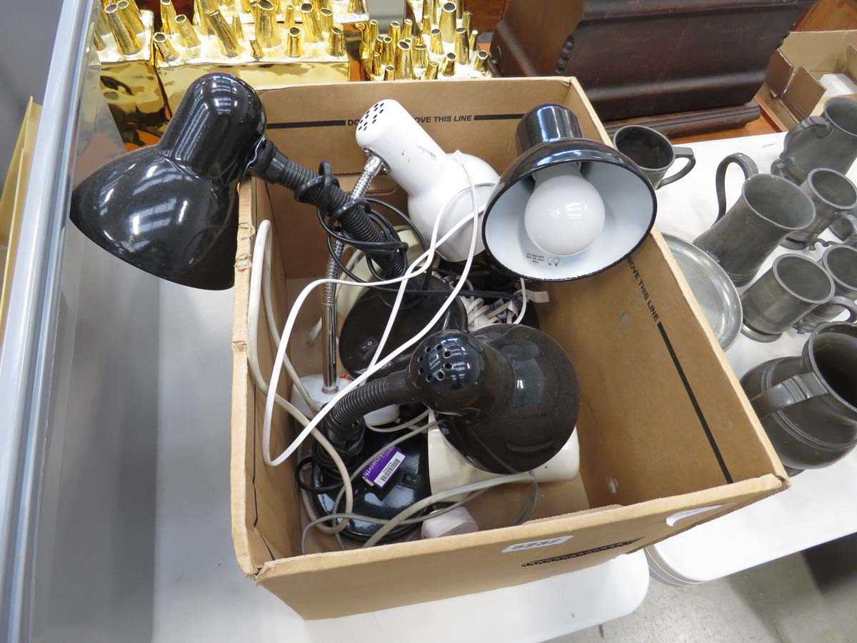 Box containing a quantity of adjustable desk lamps