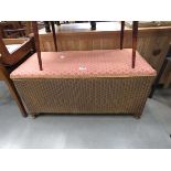 Upholstered Lloyd loom style ottoman