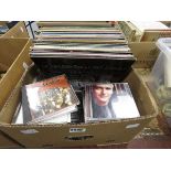 Box containing vinyl records and CDs