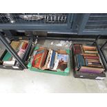 3 boxes containing reference books and novels