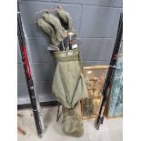 Canvas bag with quantity of vintage golf clubs