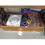 Box containing wine glasses and general crockery