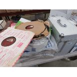 Box and stack of vinyl records