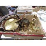 Box containing graduated copper pans, brass candlesticks and pots