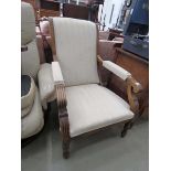 Upholstered armchair with exposed wooden frame